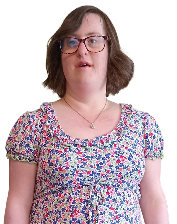 Sarah has short brown hair and glasses, and is wearing a floral-patterned dress with red, blue, and green flowers