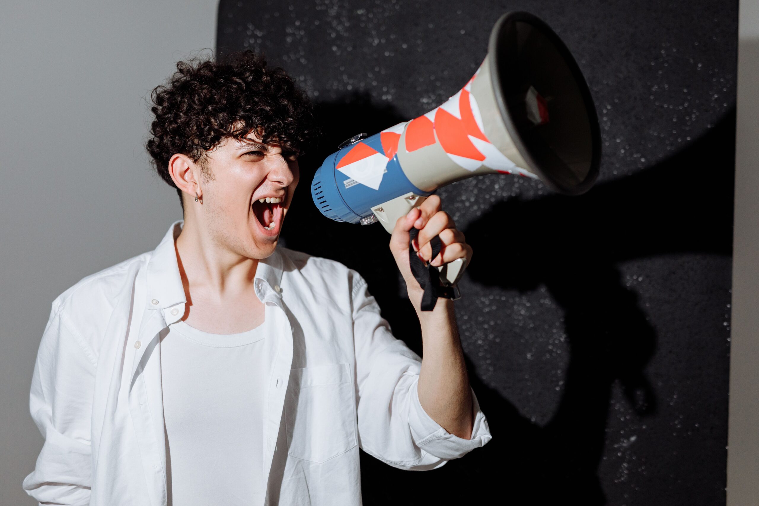 Boy shouting on the megaphone